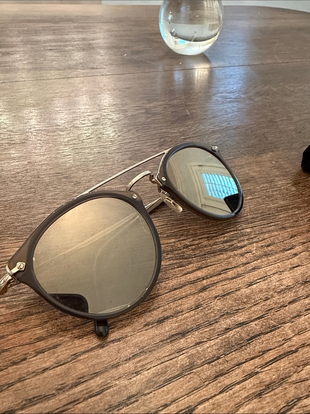 Oliver Peoples Black Round Sunglasses with Smoke Mirrors